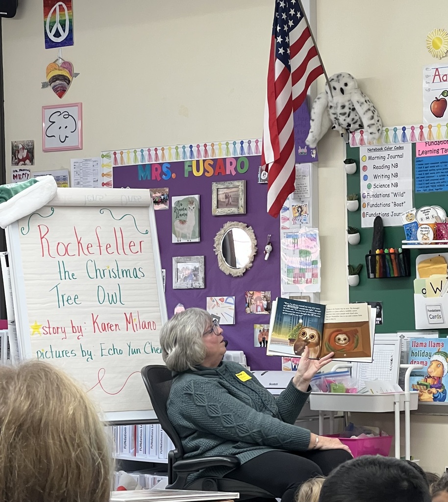 Author reading book to students