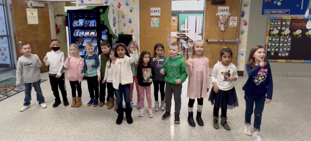 Kindergarten students perform poem
